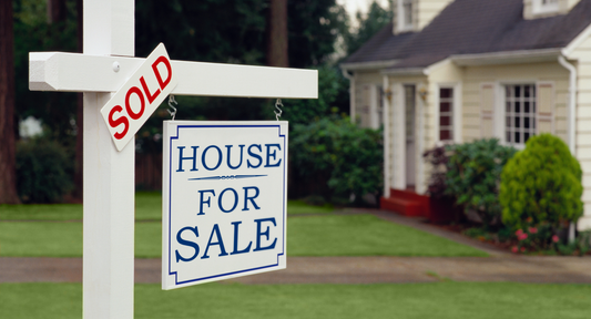 House with a sell sign